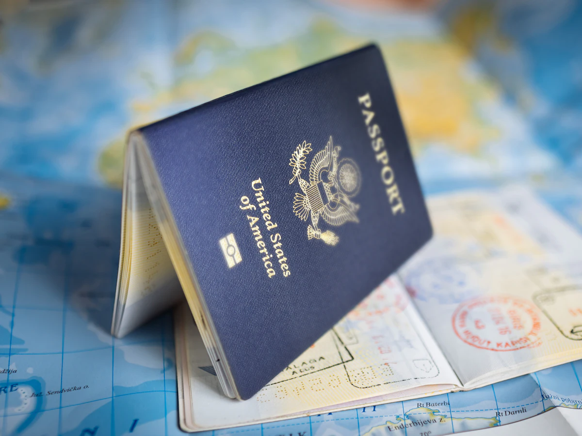 United States passport resting on a world map