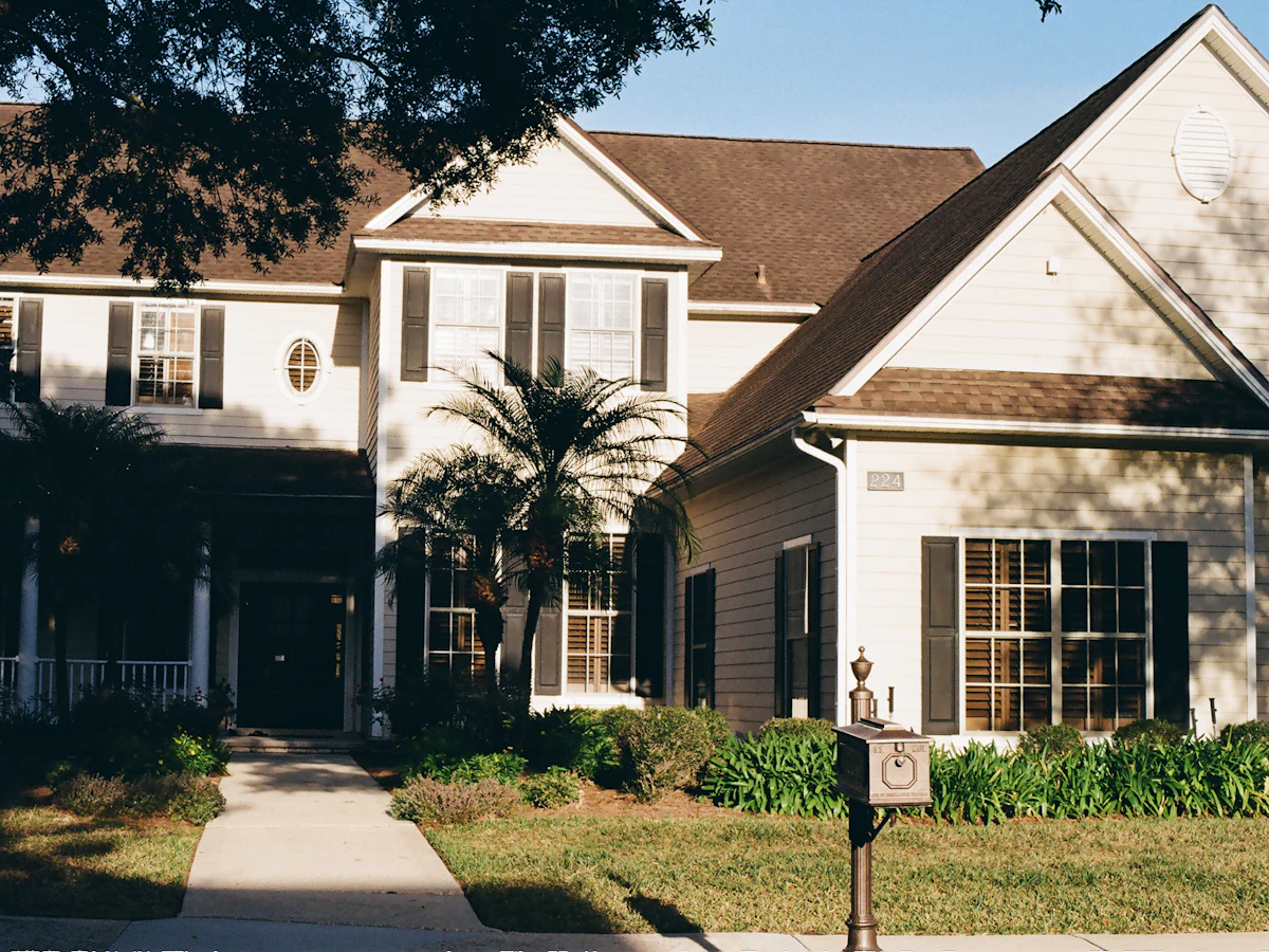 White two-story house with a front walkway